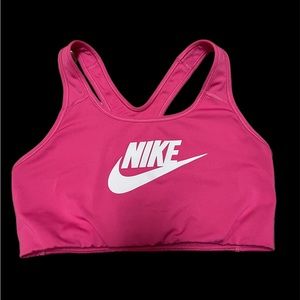 Pink sports bra by “Nike”
